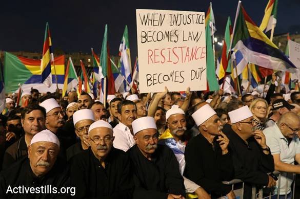 Tens of thousands of protesters joined the Druze community in rejecting the Jewish Nation-State Law at Rabin Square in Tel Aviv on August 5, 2018. (Oren Ziv/Activestills.org)